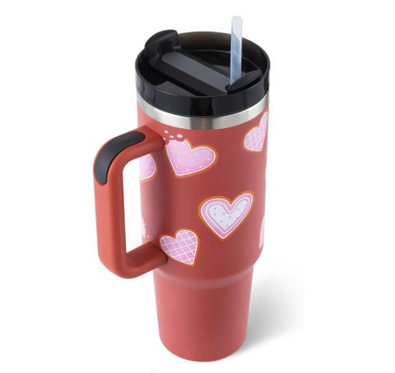 Red travel mug with heart patterns 