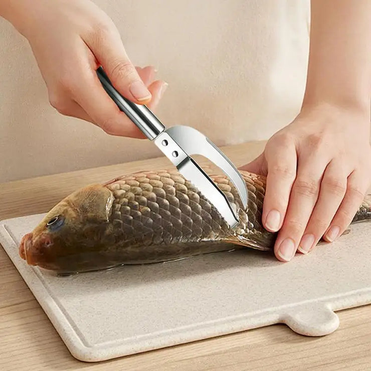 Person using a fish scaler on a fish 