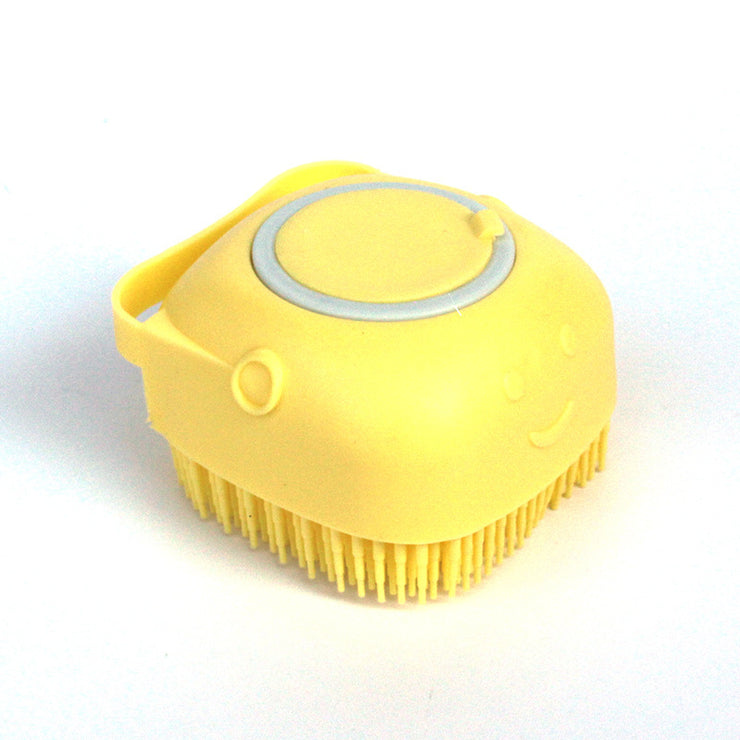 Dog grooming brush with shampoo holder