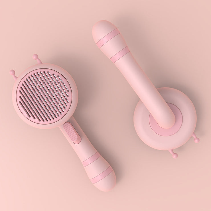 Portable cat grooming brush in pink color